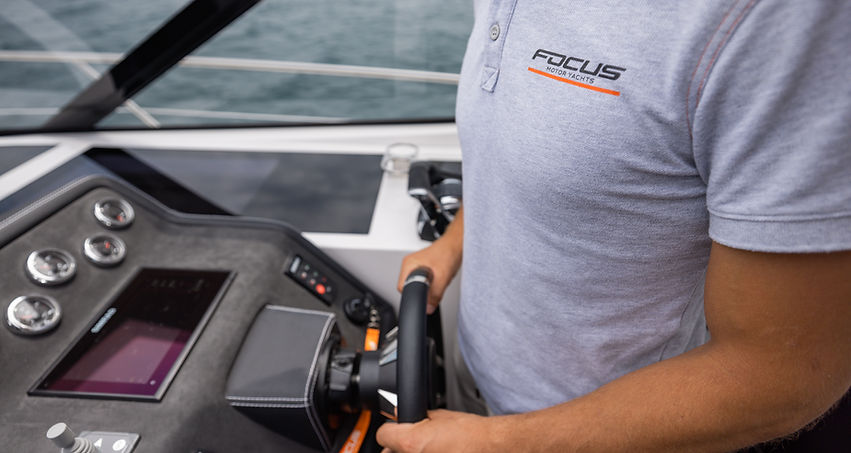 Focus Motor Yachts captain at the helm